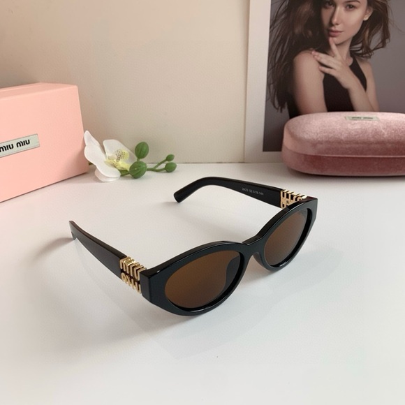 Miu Miu Black Sunglasses with Gold Detailing - Picture 1 of 3